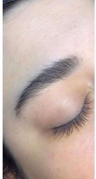 Eyebrow before threading, unshaped brow