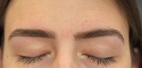 Both eyebrows after threading, clean defined arches