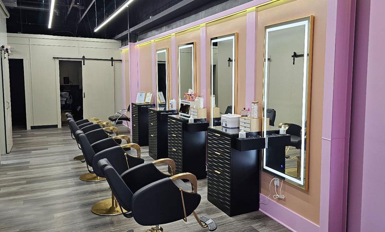 Inside Rozy's Threading & Waxing Studio — real studio interior with treatment chairs and lighted mirrors